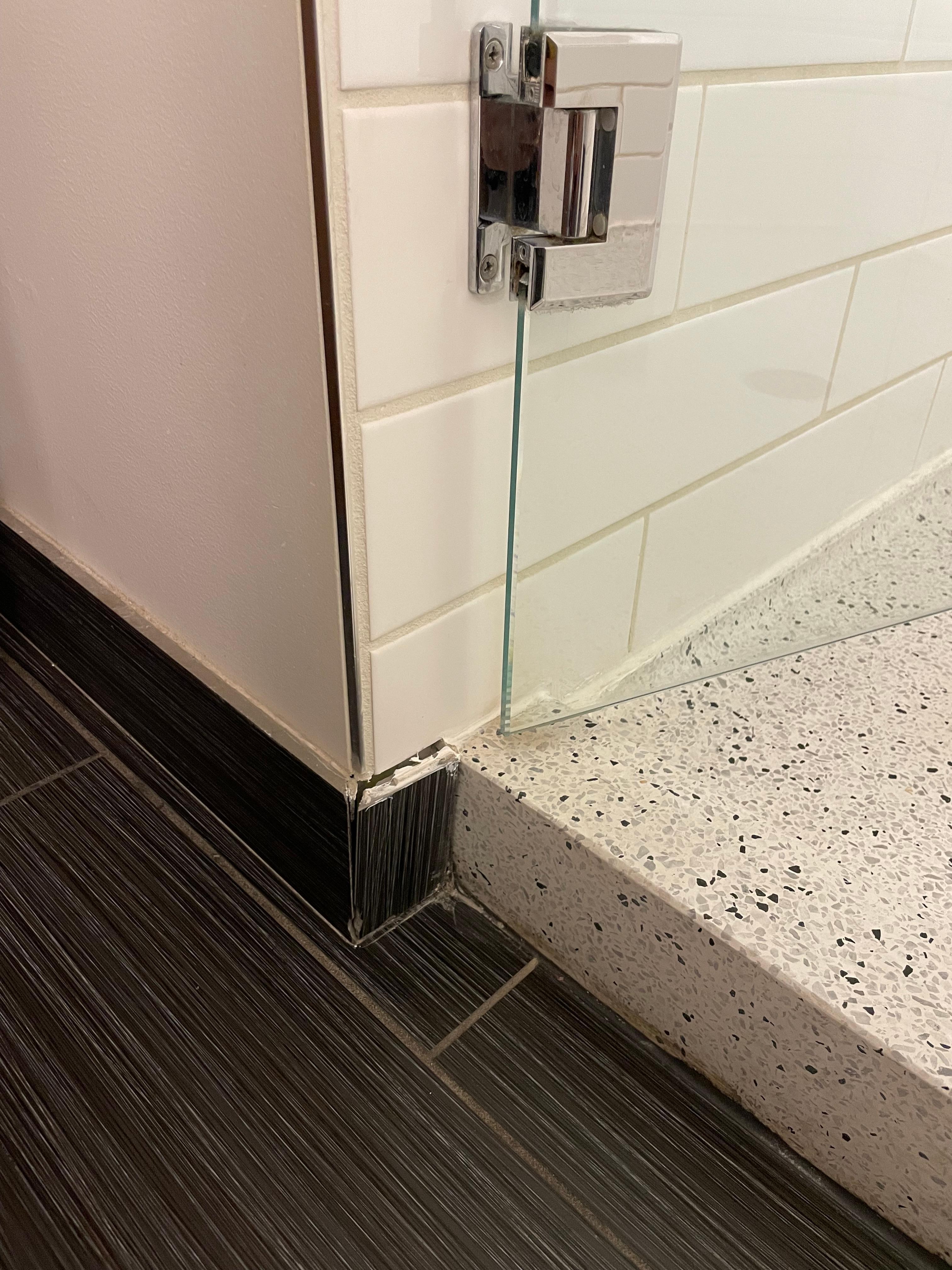 Tile coming off the wall