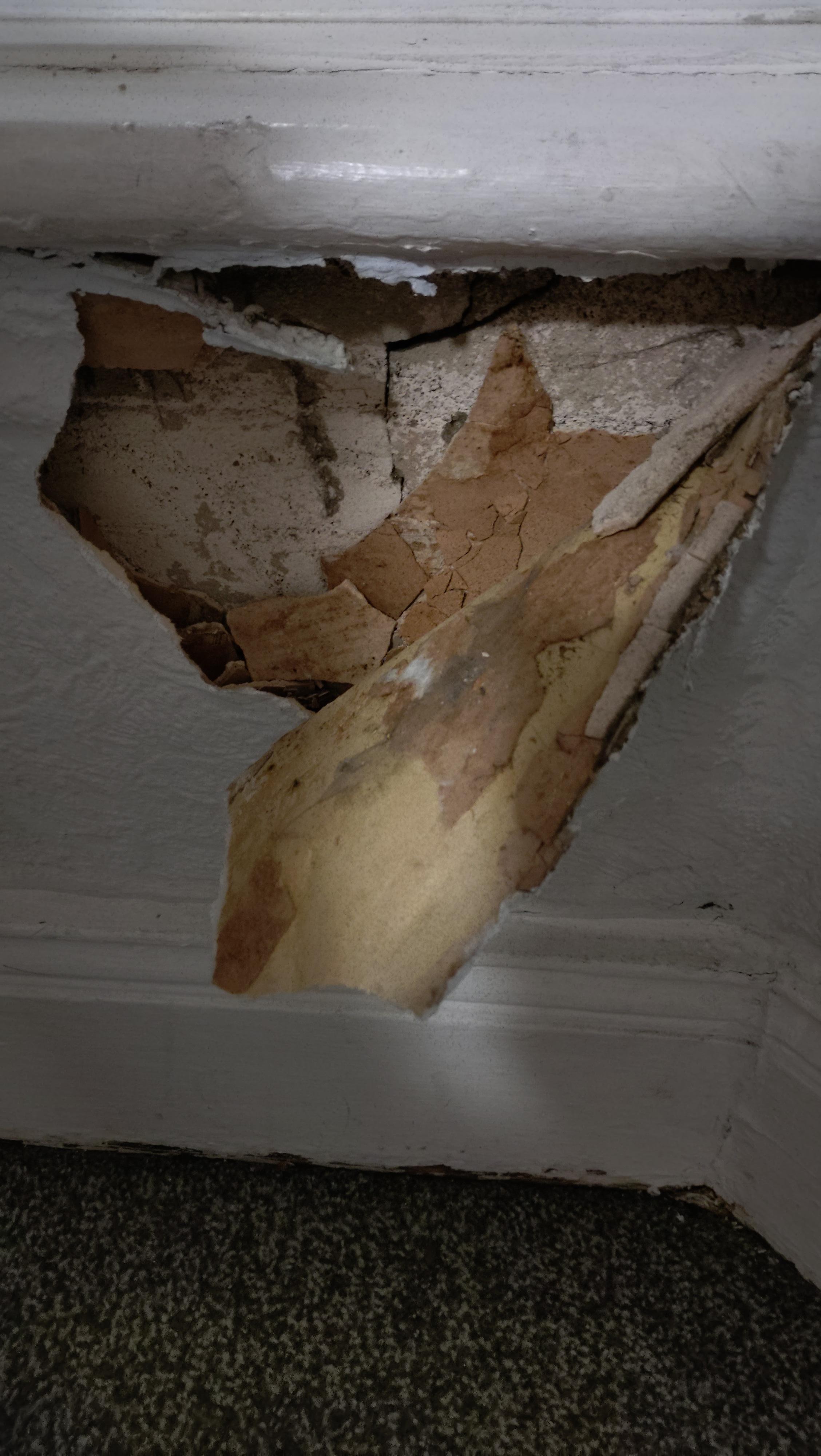 Hole under window with wind blowing through 