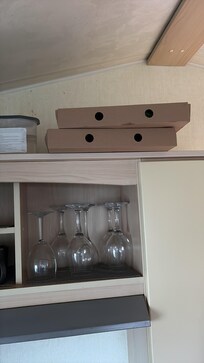Boxes left on top of cupboard