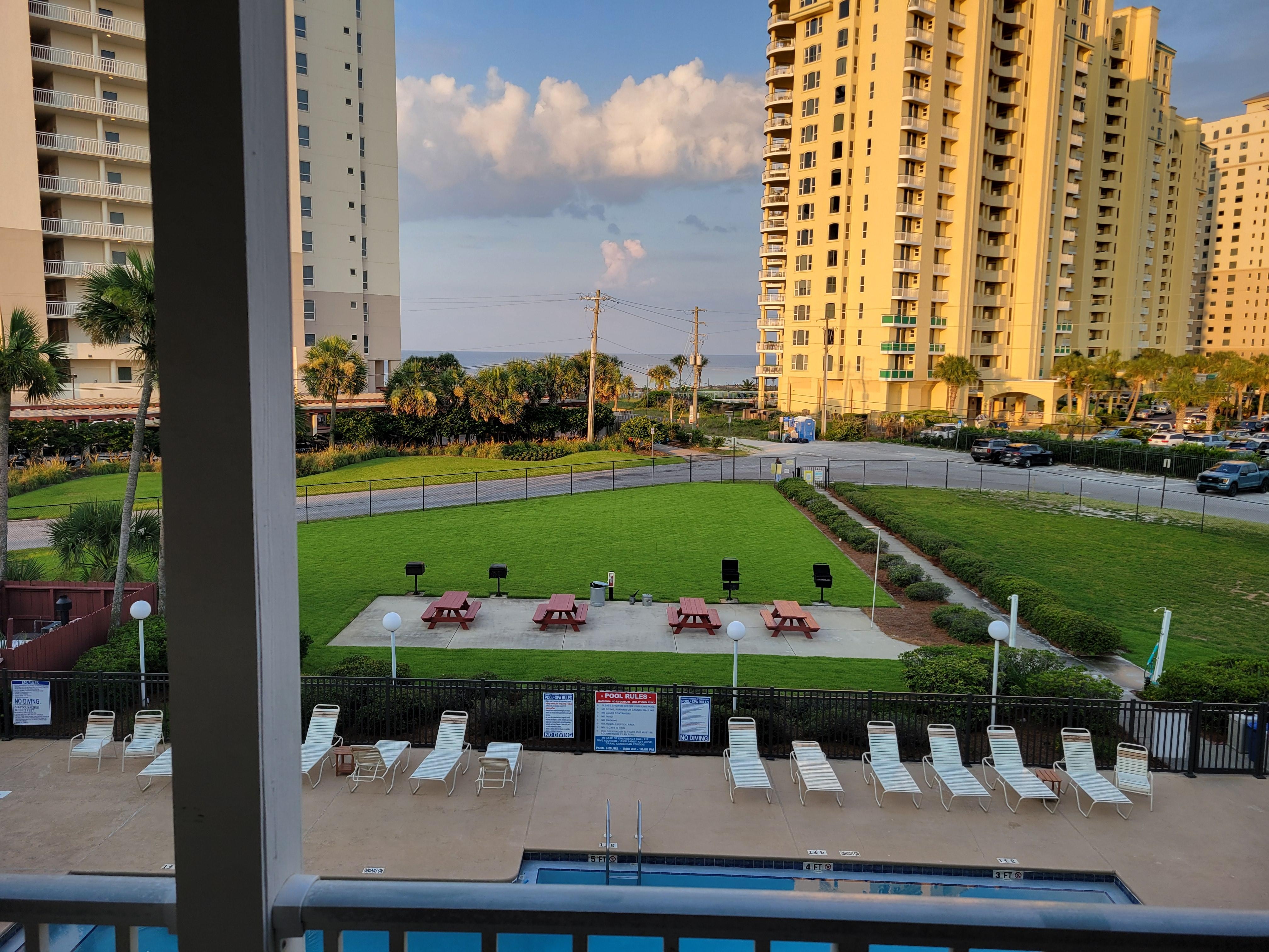 View from the balcony...beach access right across the street from the end of the sidewalk.