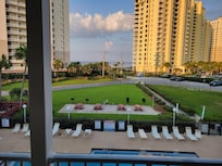 View from the balcony...beach access right across the street from the end of the sidewalk.