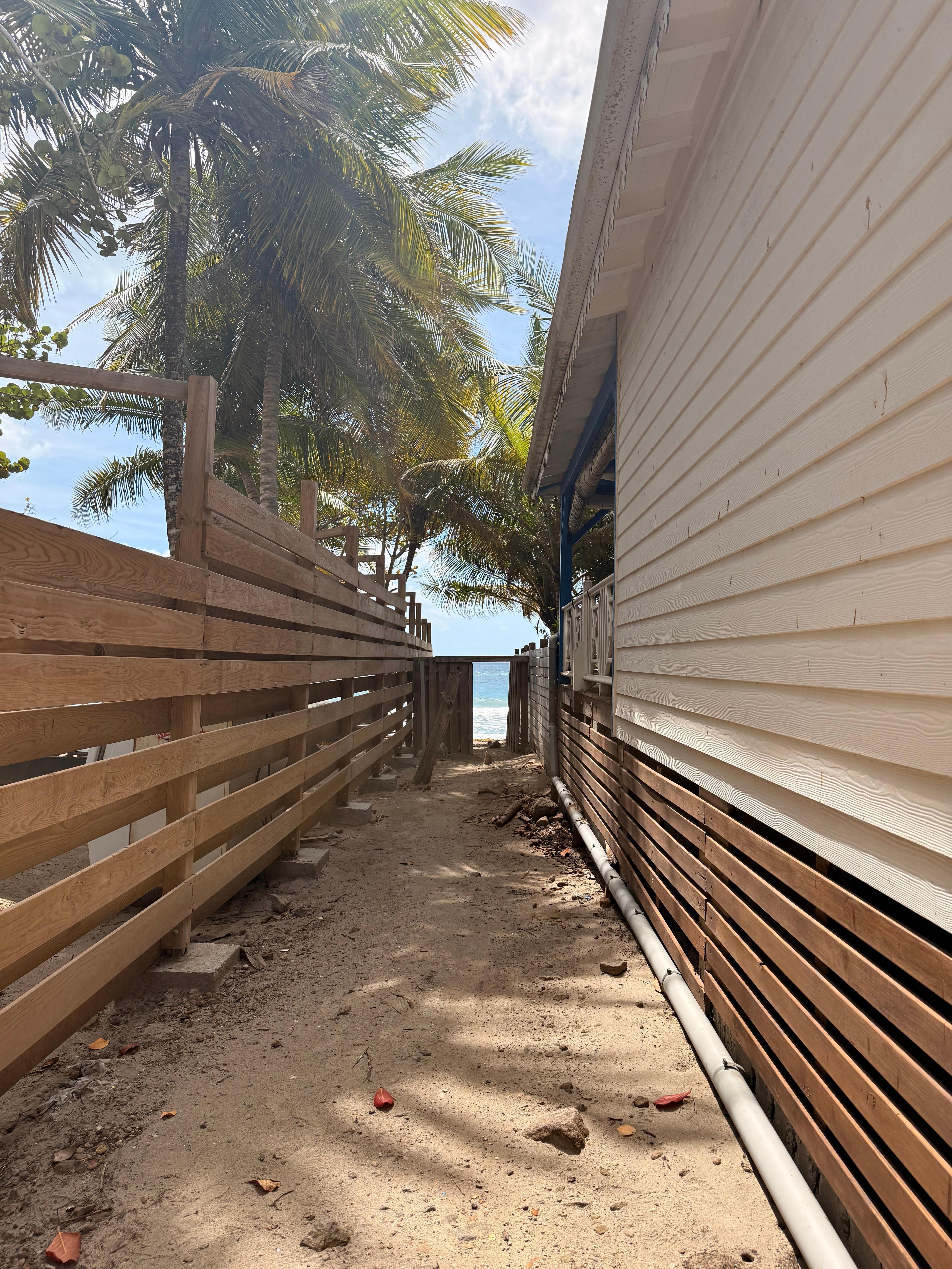 Pathway to the beach,  just across the parking lot.
