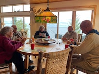 Cards at the dining room table on a rainy day