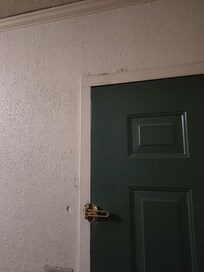 Broken door latch top, bottom lock didn't work, had to place table in front of door.