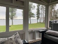 The screen room is a great place to read, eat, play a game or take a nap