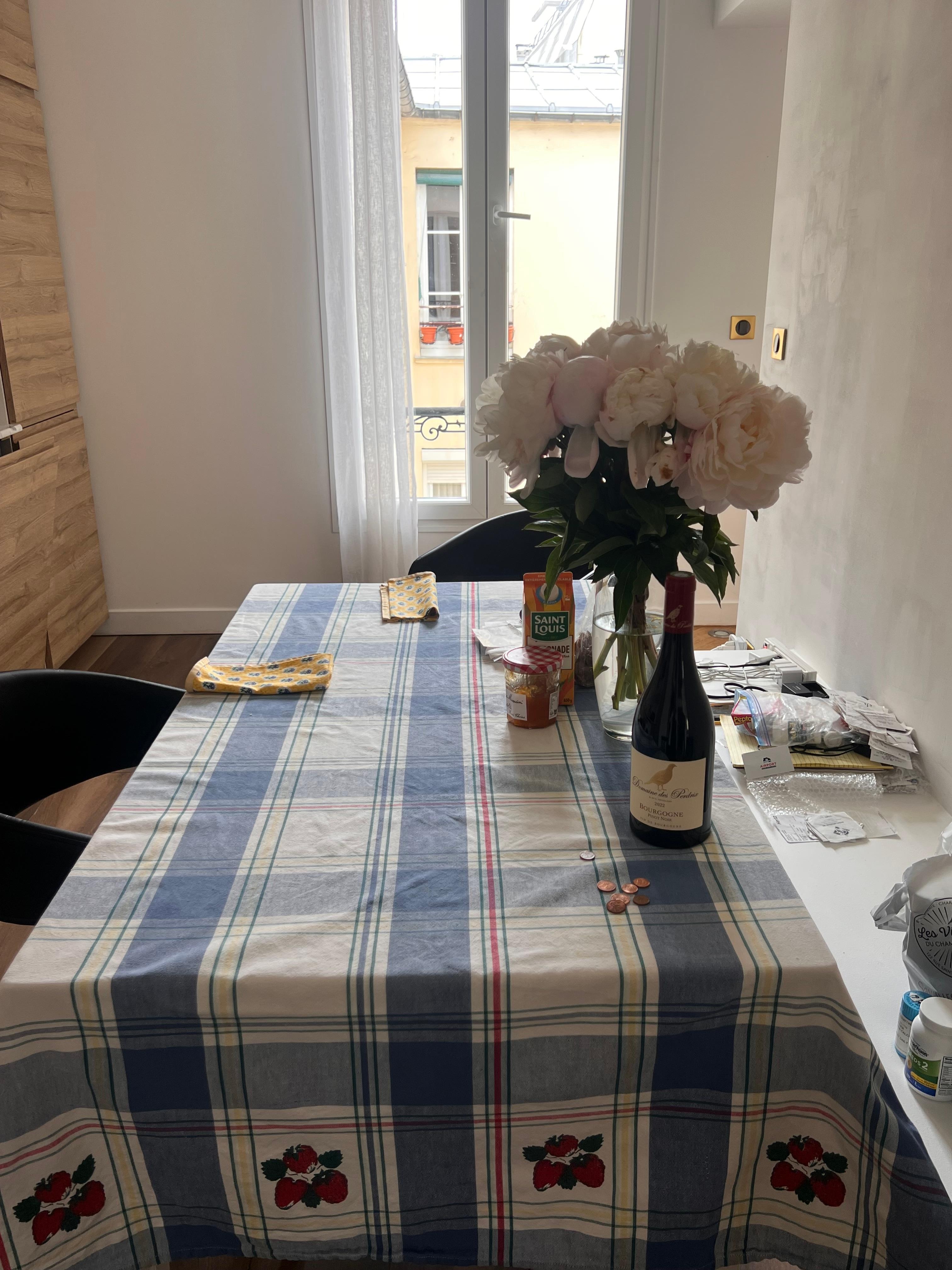 We brought our own tablecloth, and bought a vase for flowers 