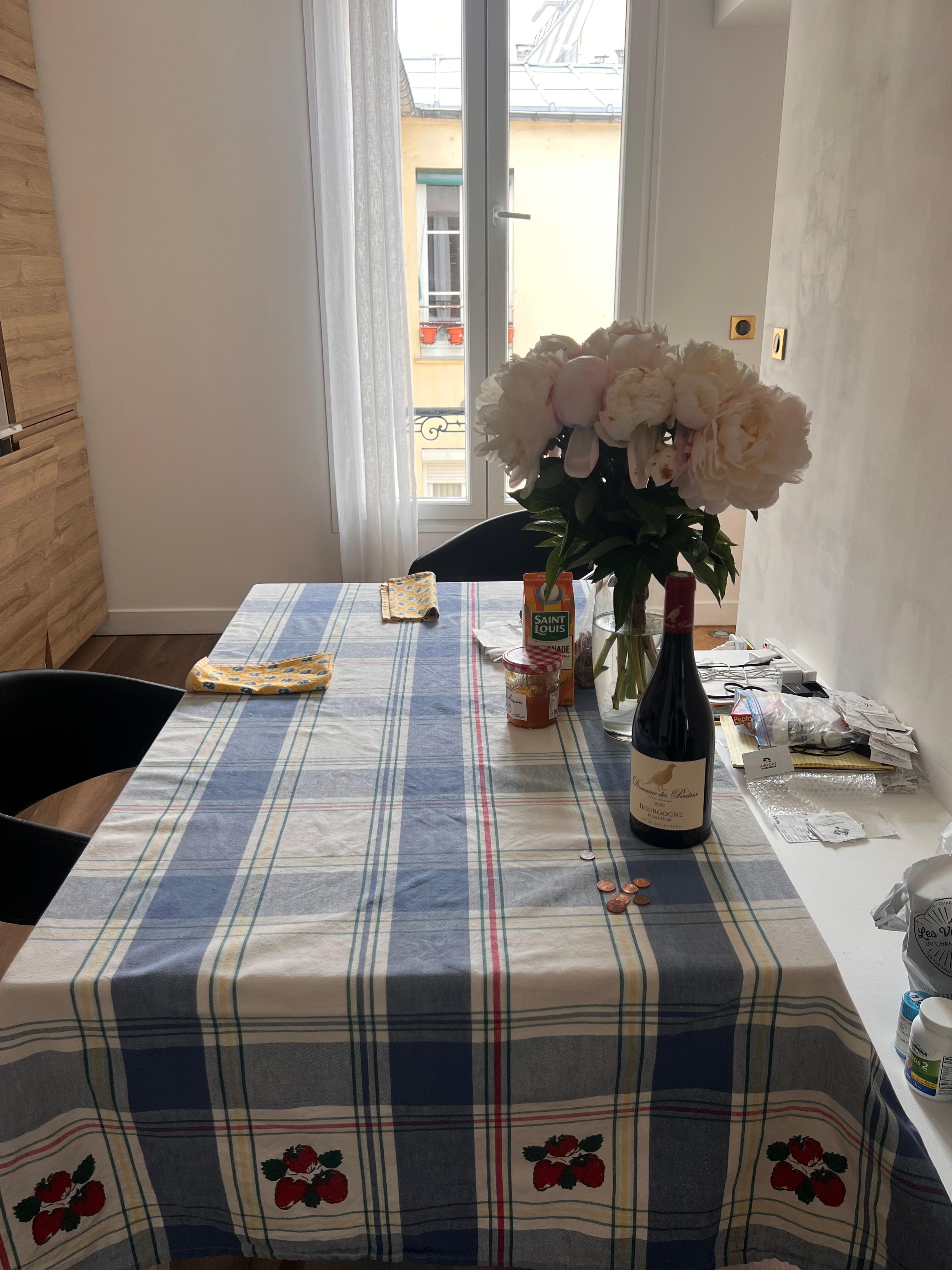 We brought our own tablecloth, and bought a vase for flowers 