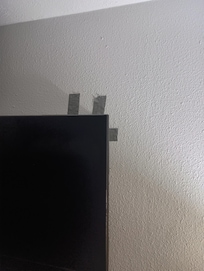 TV duck taped to keep it up