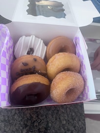Walk to this donut shop. These cake donuts are as good as the sunsets. Get there early...a line always. Webbers (I think).