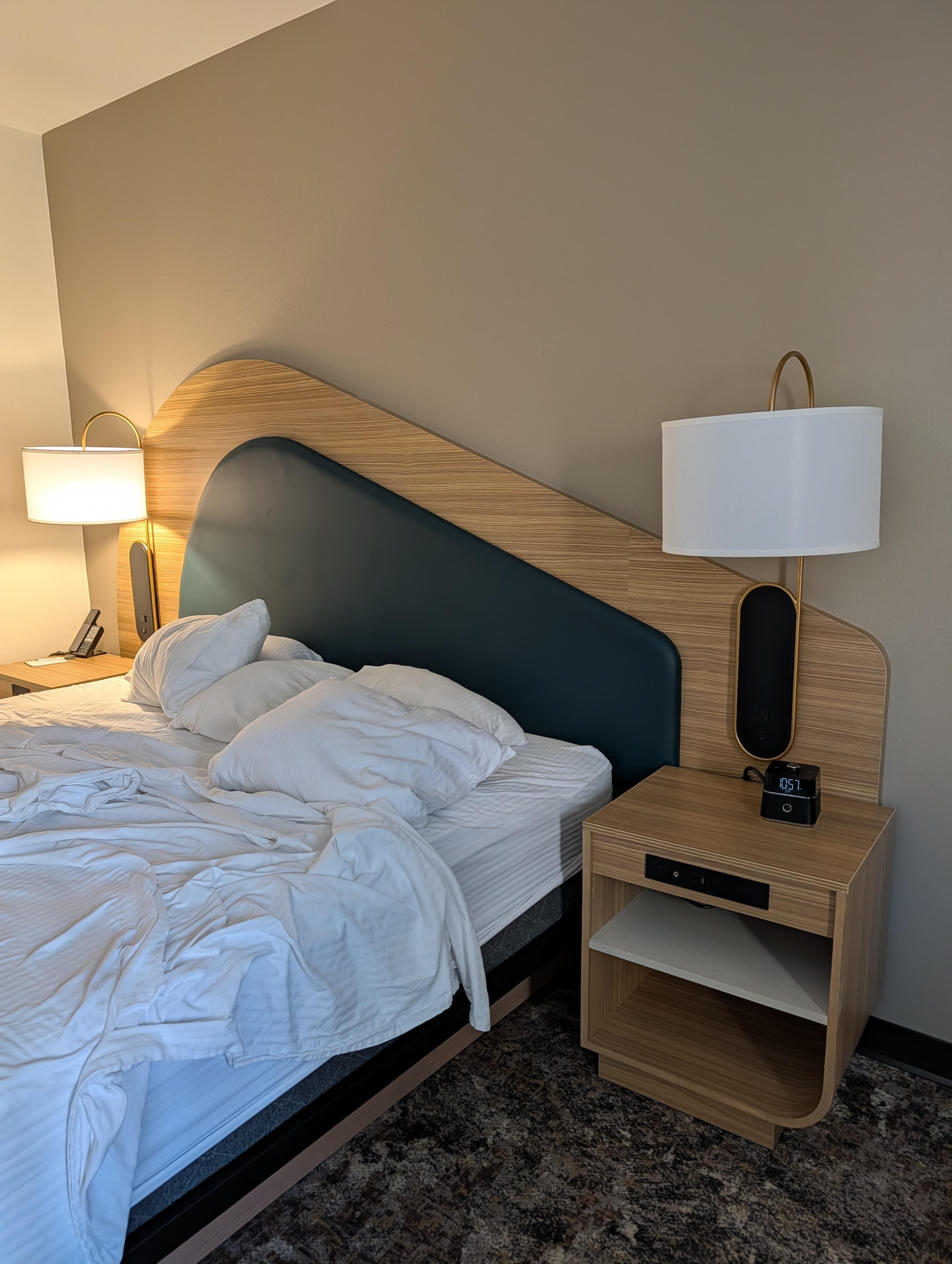 Very contemporary fun decor.  Should have made the bed, oops