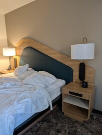 Very contemporary fun decor. Should have made the bed, oops