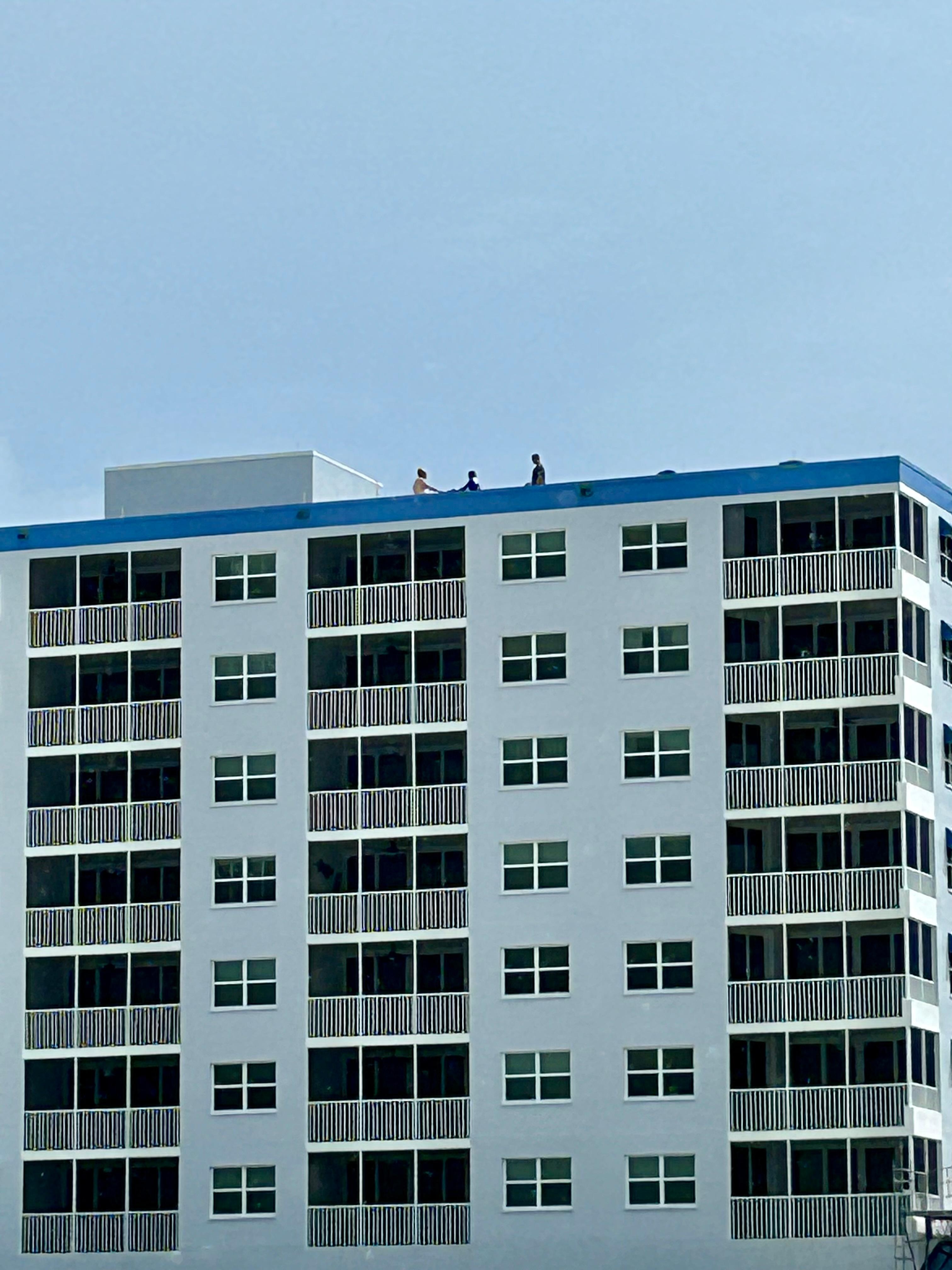 3 men working DIRECTLY over our condo! 