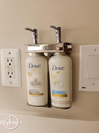 Hand soap and lotion by the bathroom sink.