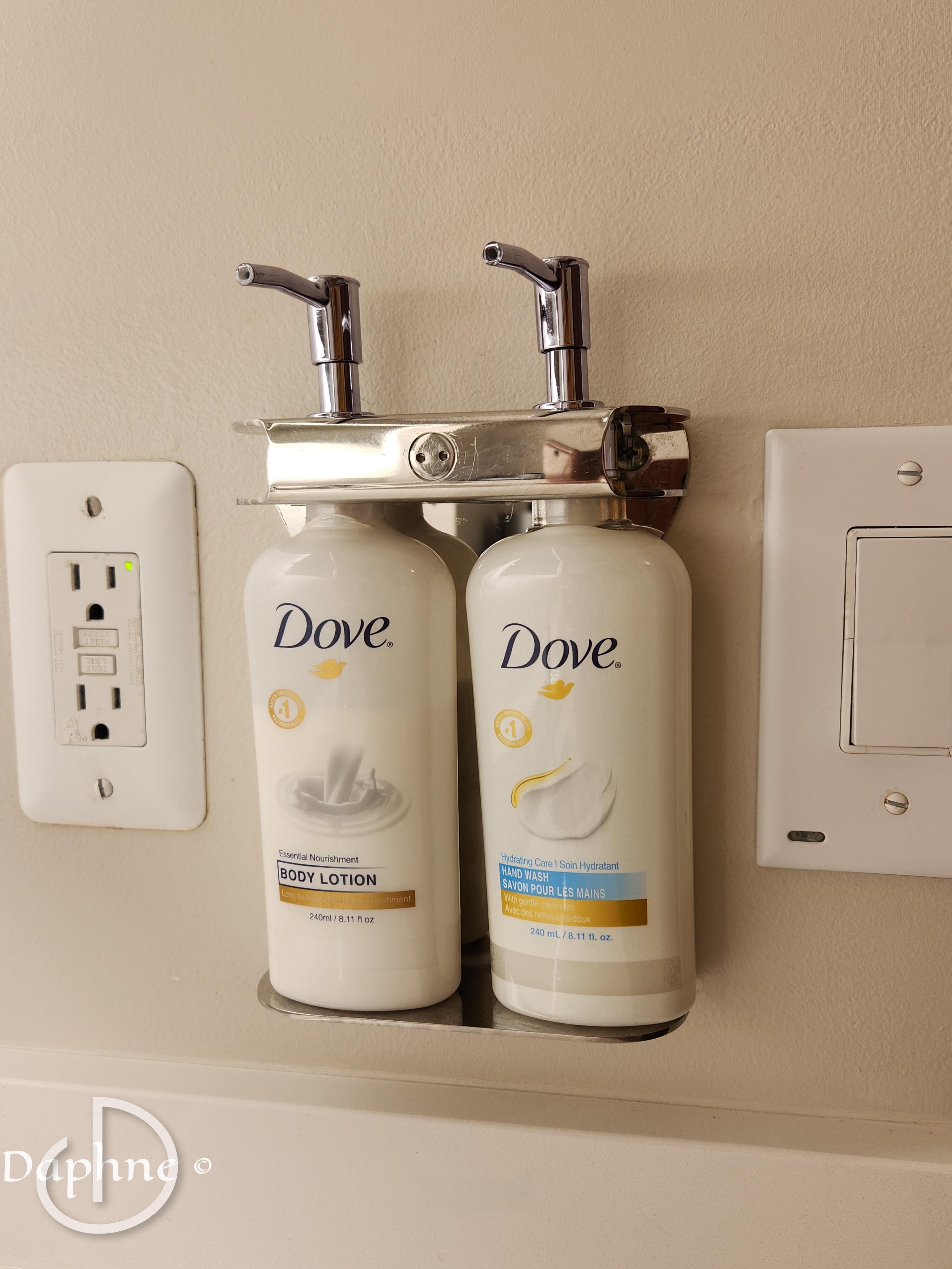 Hand soap and lotion by the bathroom sink.