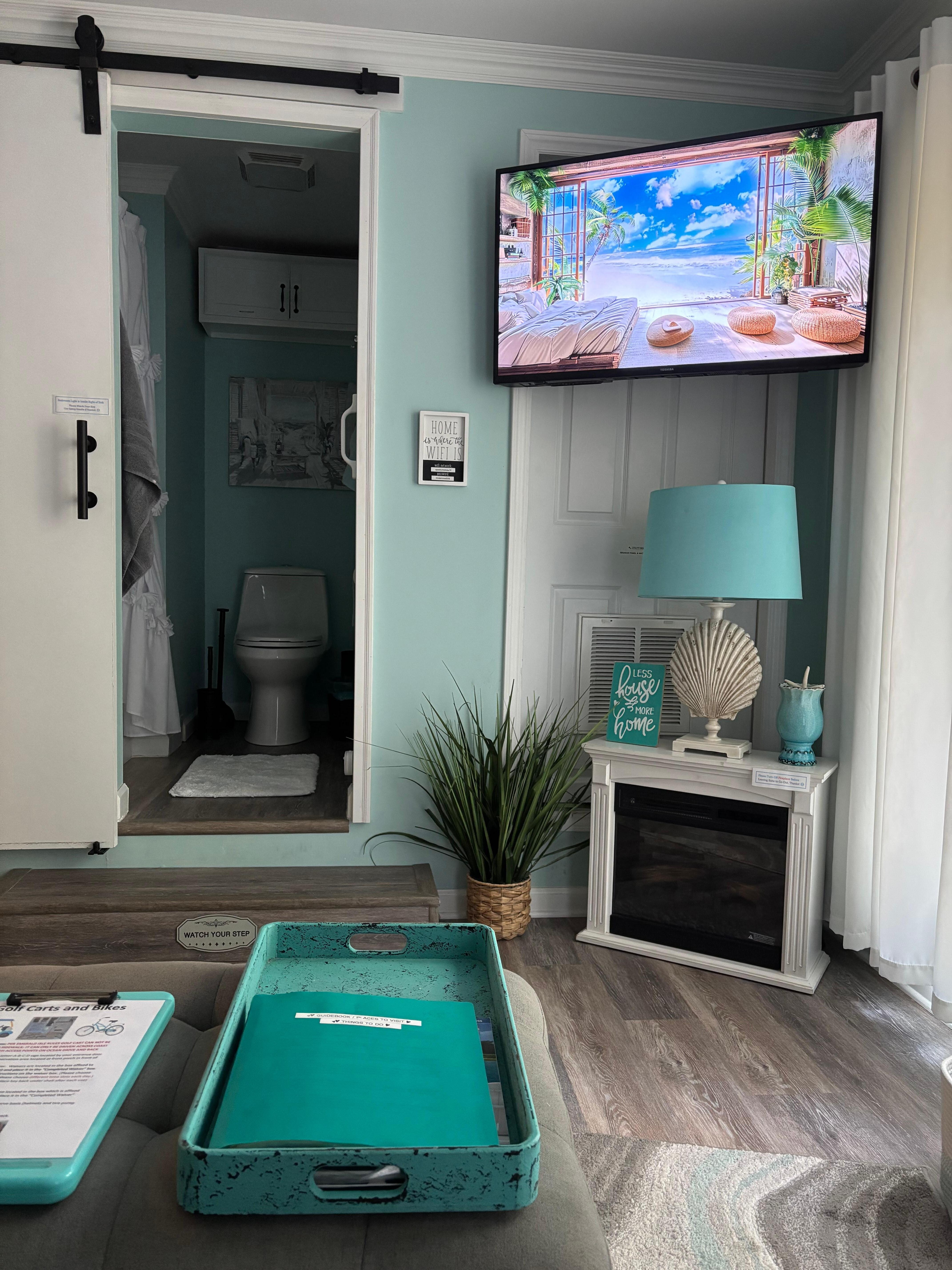 Living room and bathroom in Suite B. (Kitchenette and  bedroom with queen-size bed would be off to left)