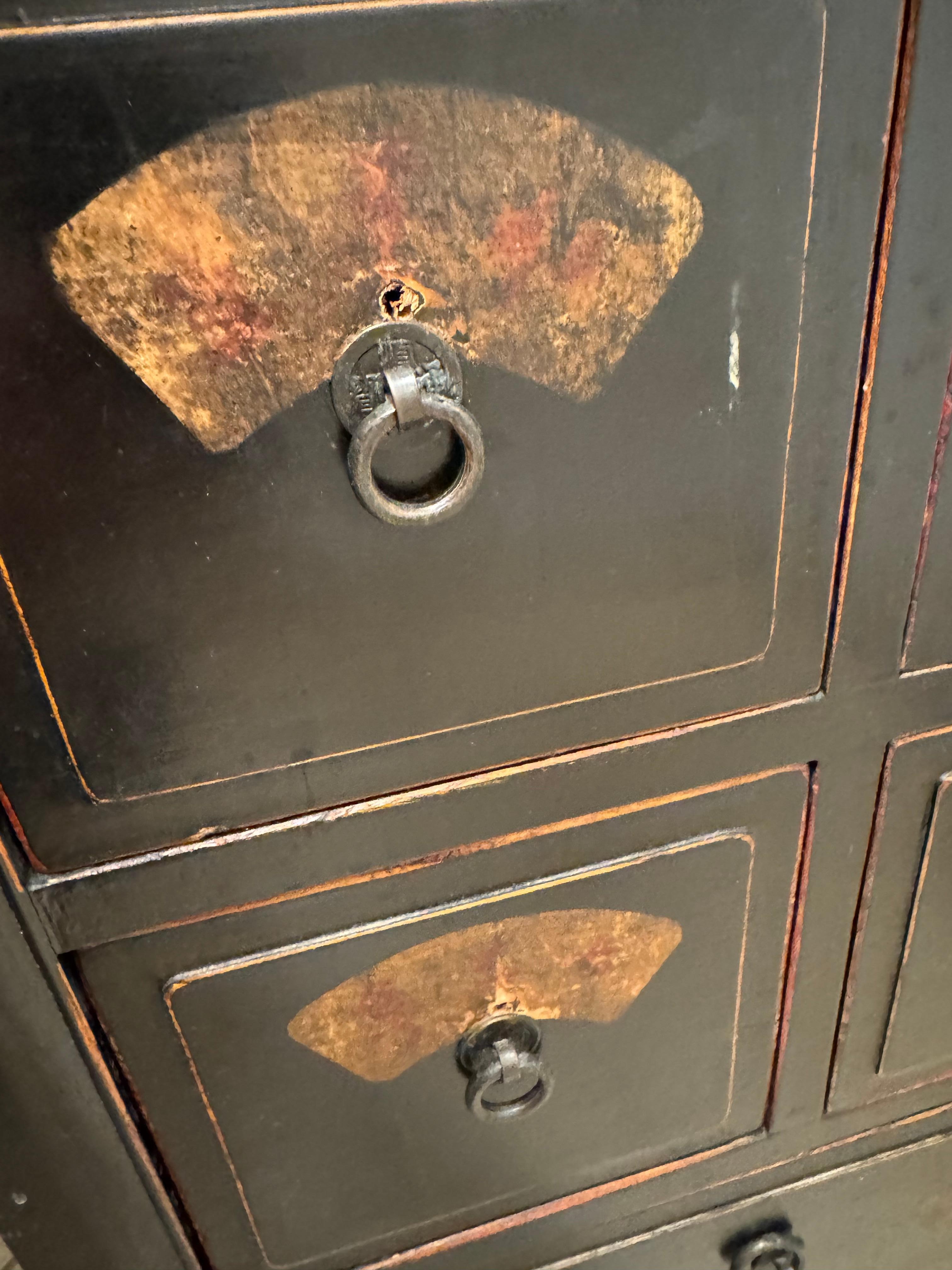 Weird dresser with handles ripped off and rings put in place 