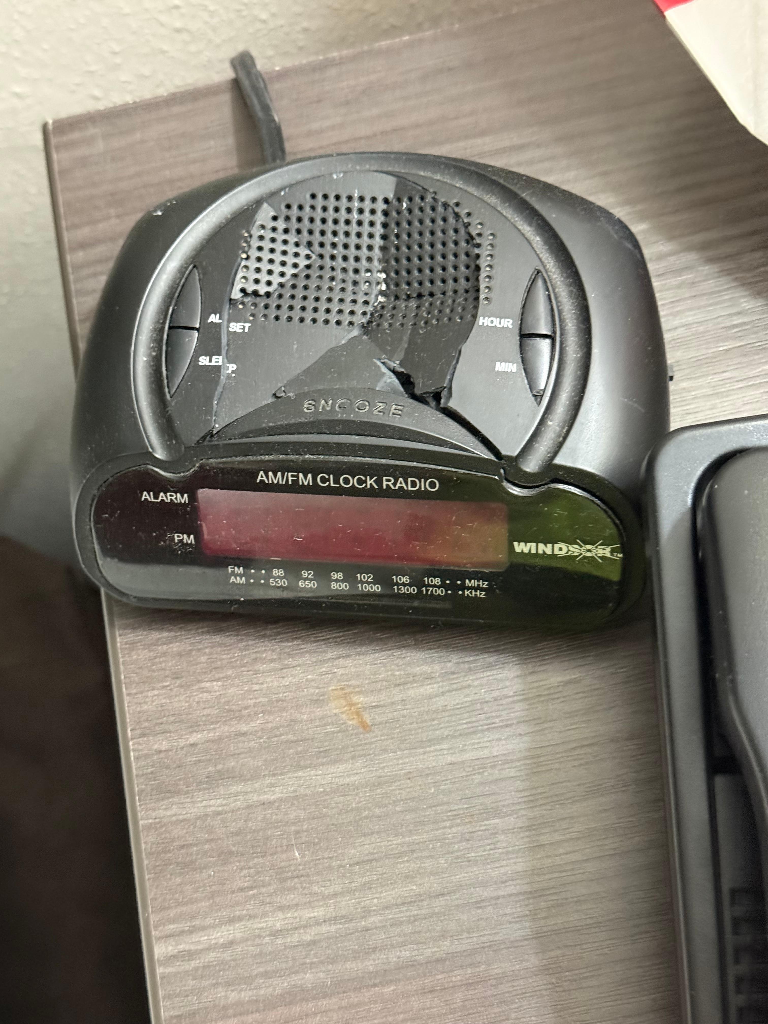 Clock on table smashed. 