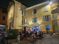 Two bars full of people drinking and talking loudly. Expect it to be loud at night.