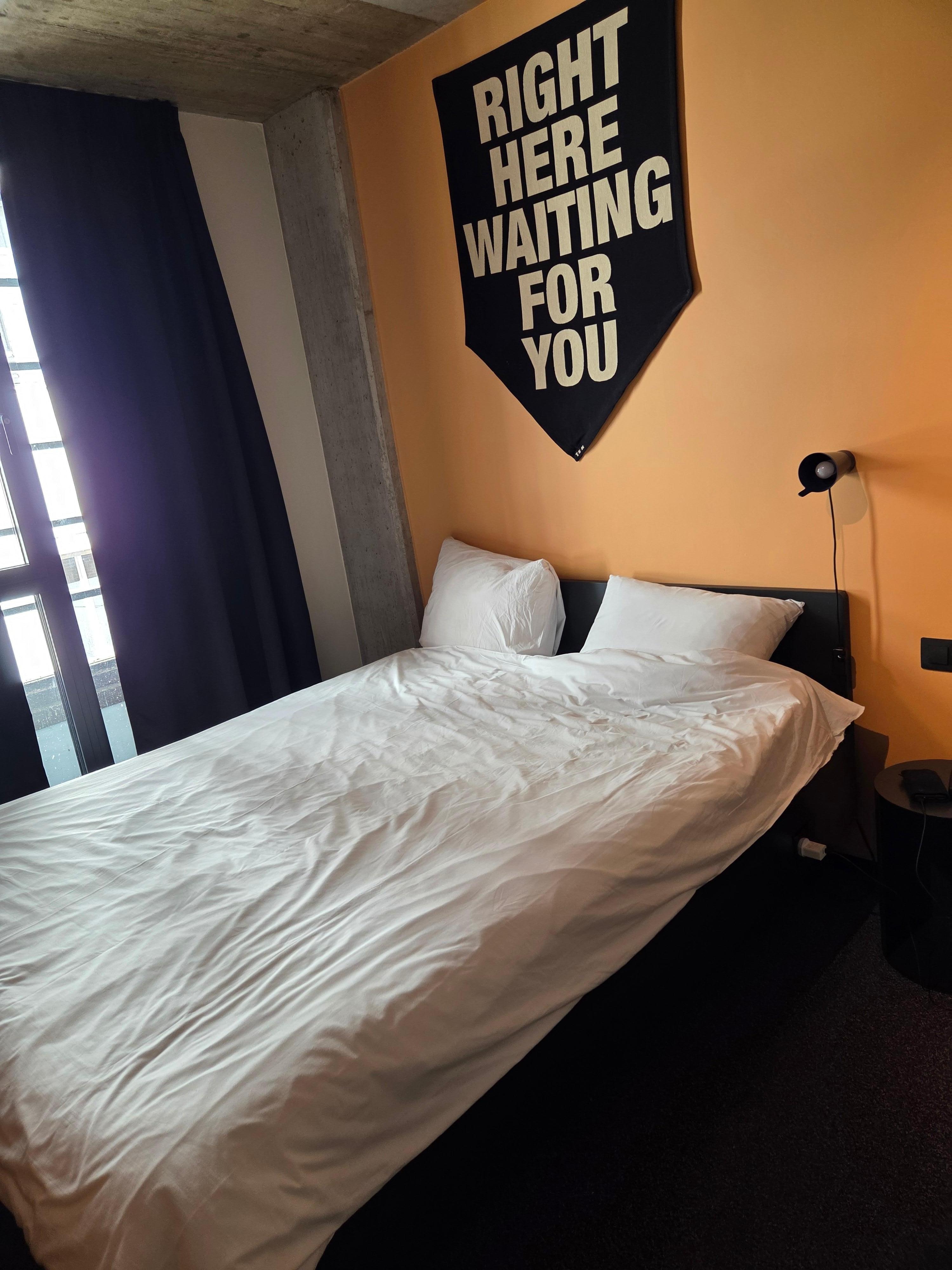 The bed after room was serviced.