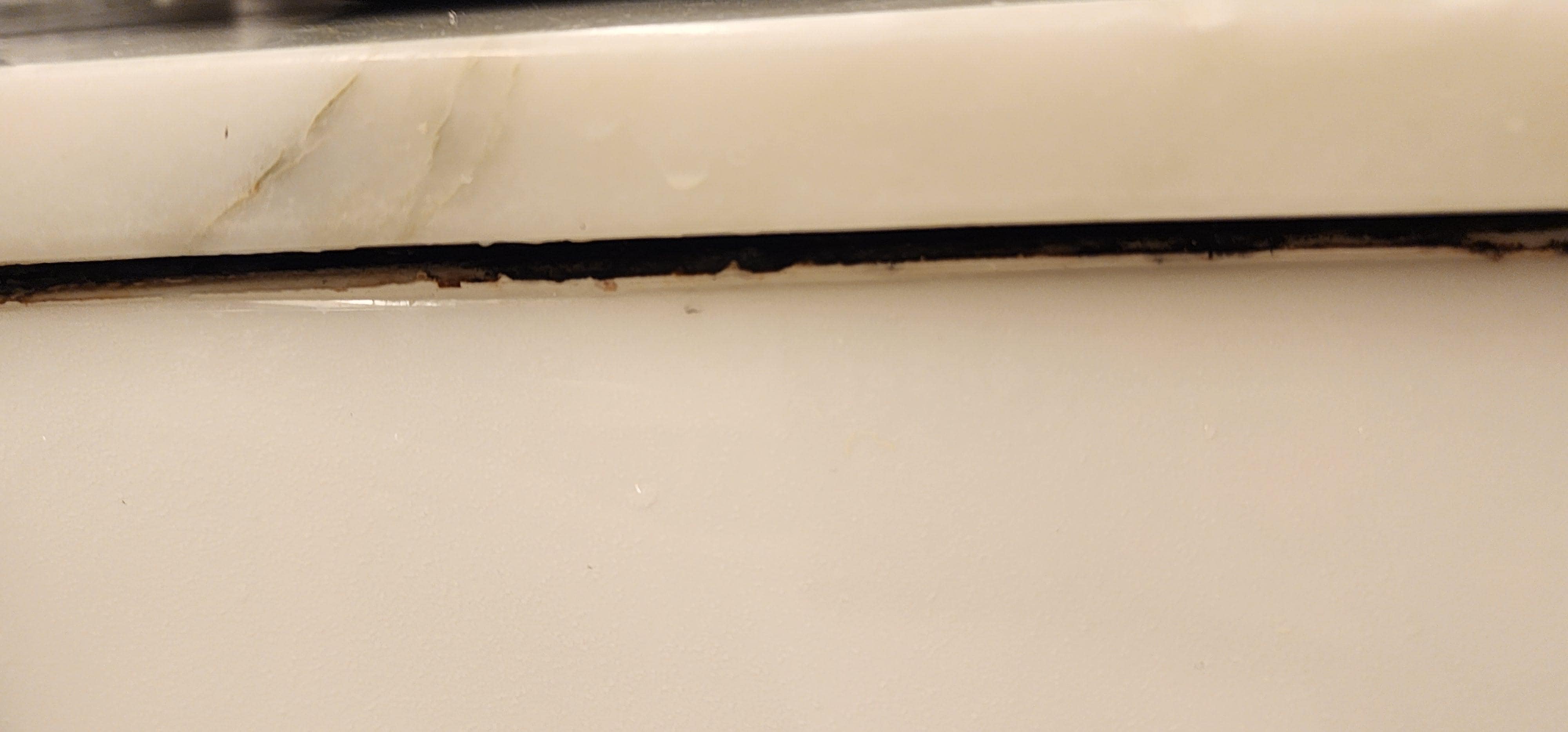 Black mold around bathroom sink
