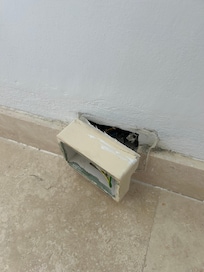 Exposed electrical in hallway