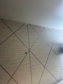 Hole in wall facing shower?