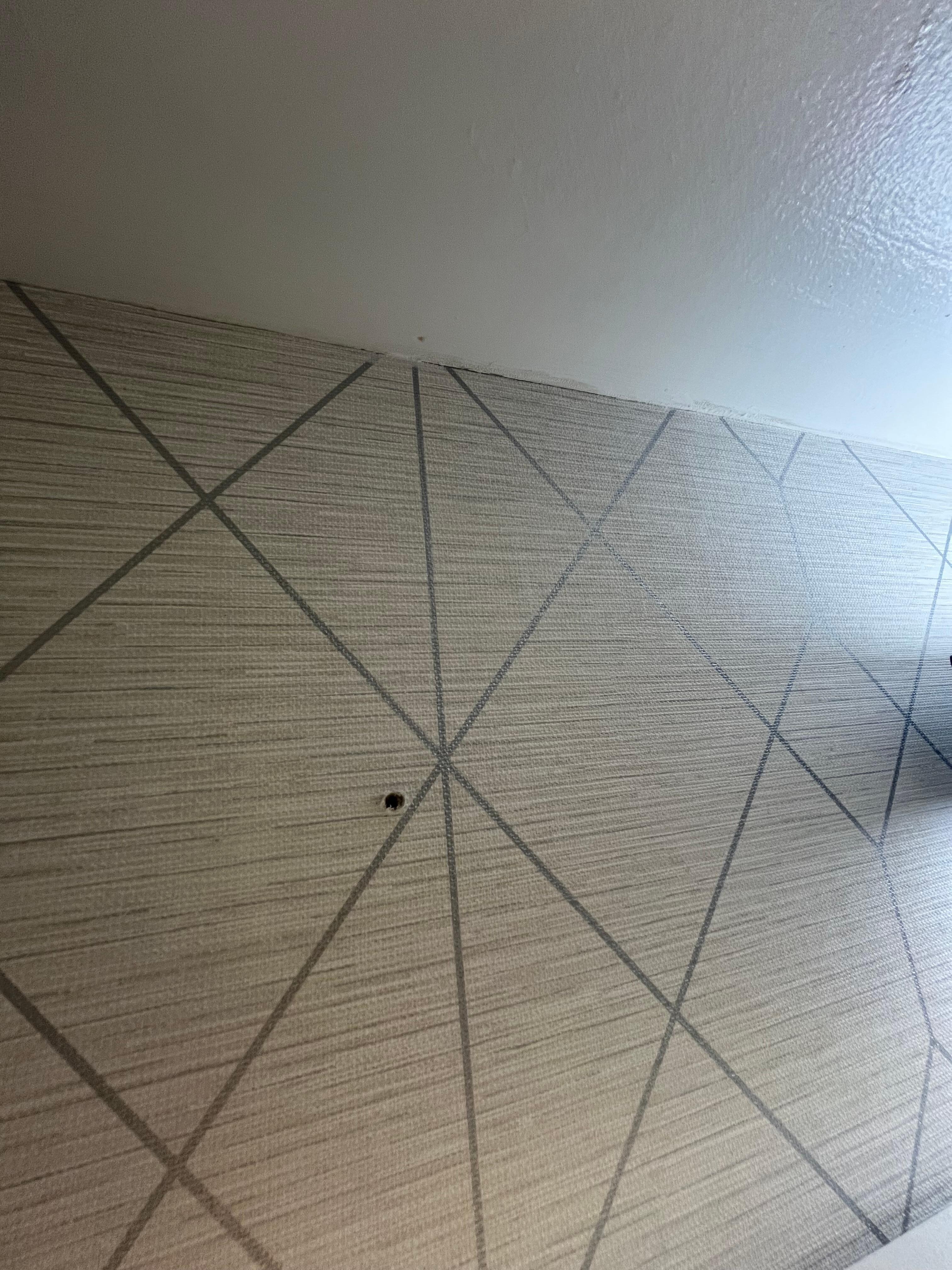 Hole in wall facing shower?