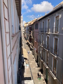 Third floor view from balcony towards the right, at night, very lively vibe and restaurants