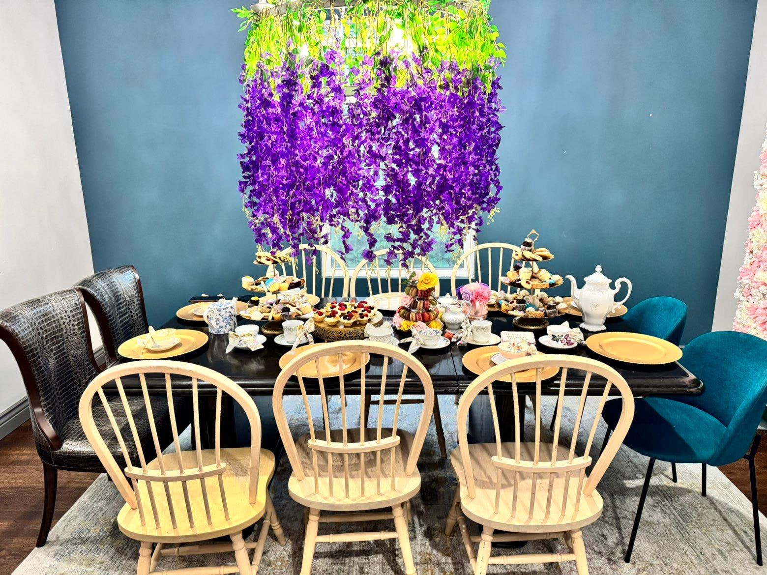 We could fit 10 people to the dining table comfortably. The chandelier was perfect for hanging wysteria to give the best Bridgerton vibes!