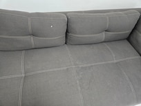 Dirty and ripped couch.