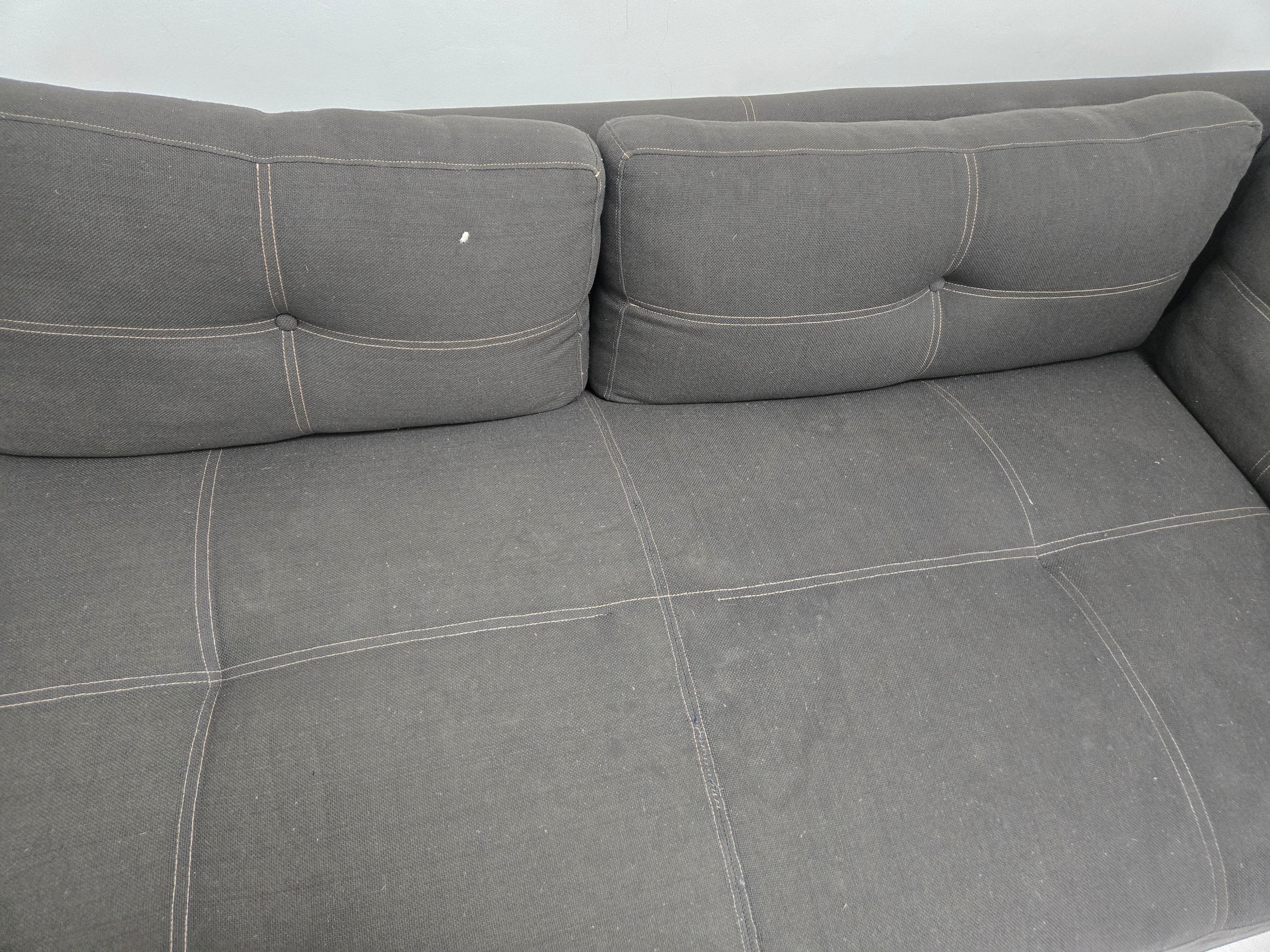 Dirty and ripped couch.