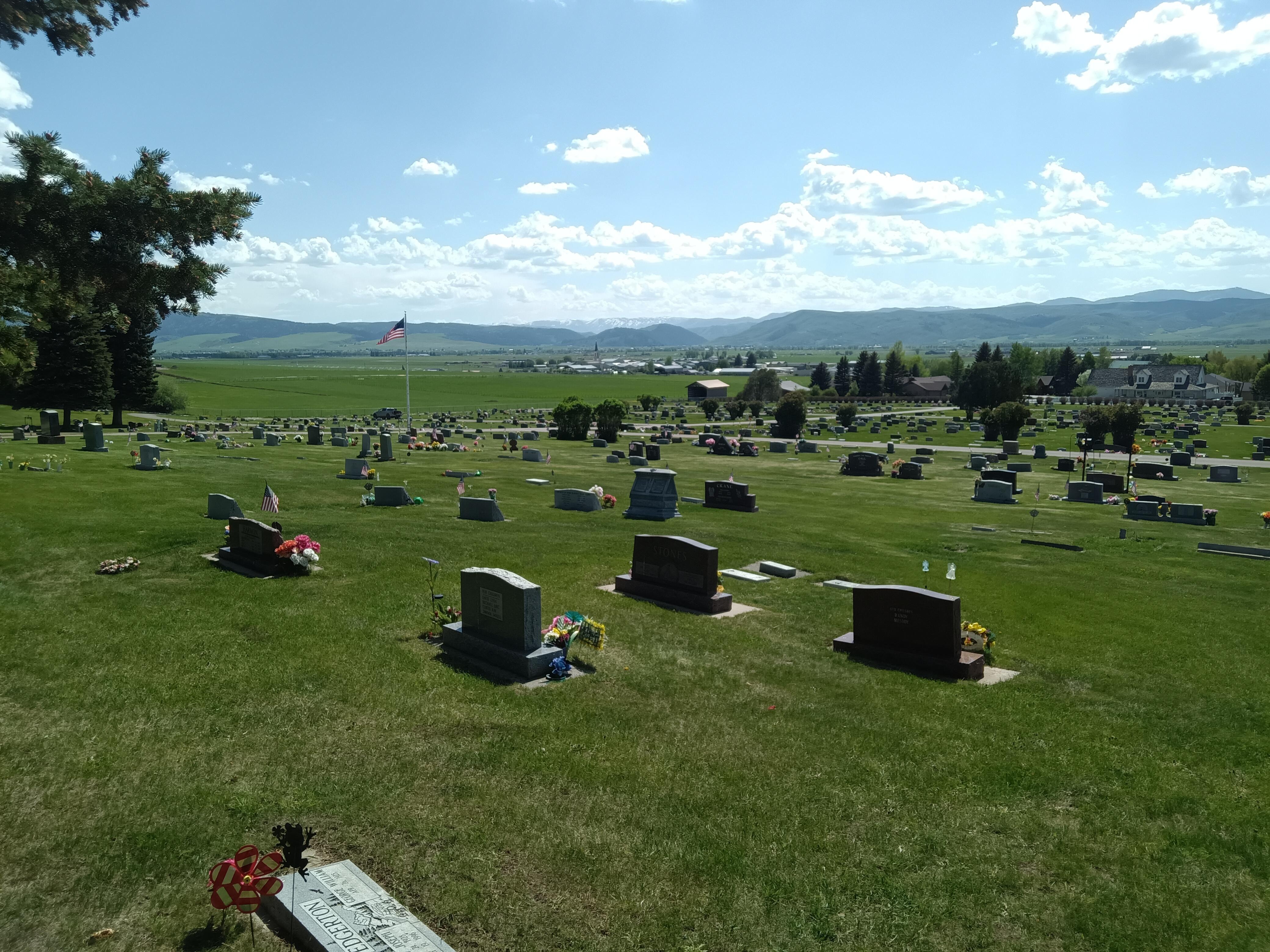 Memorial Day honors at Afton cemetery with Star Valley behind