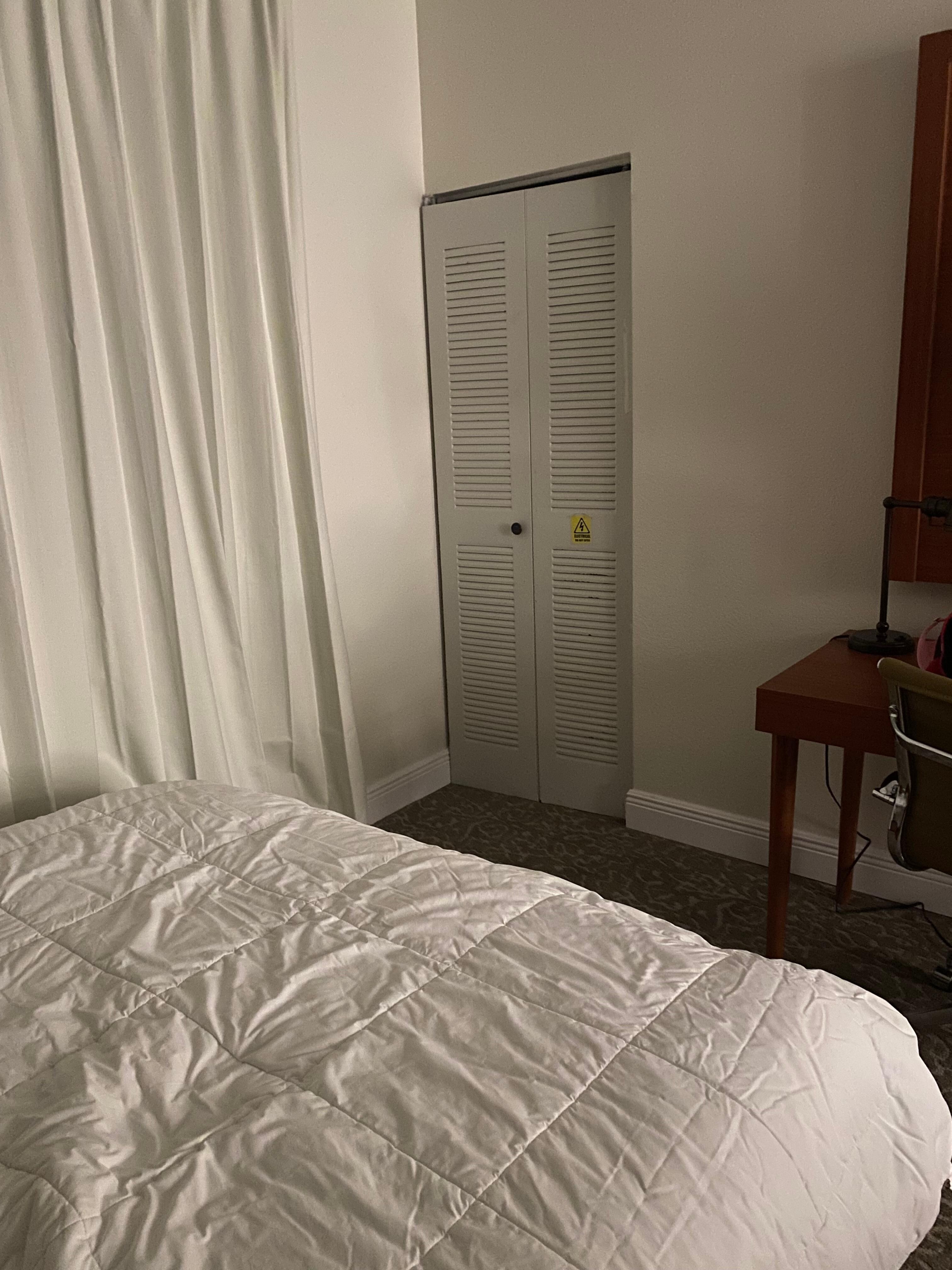 “AC Unit” closet with “electrical do not open” 