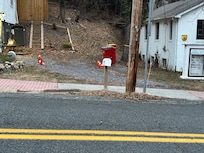 The parking is a challenge. There’s a ditch and a pole blocking the spot.