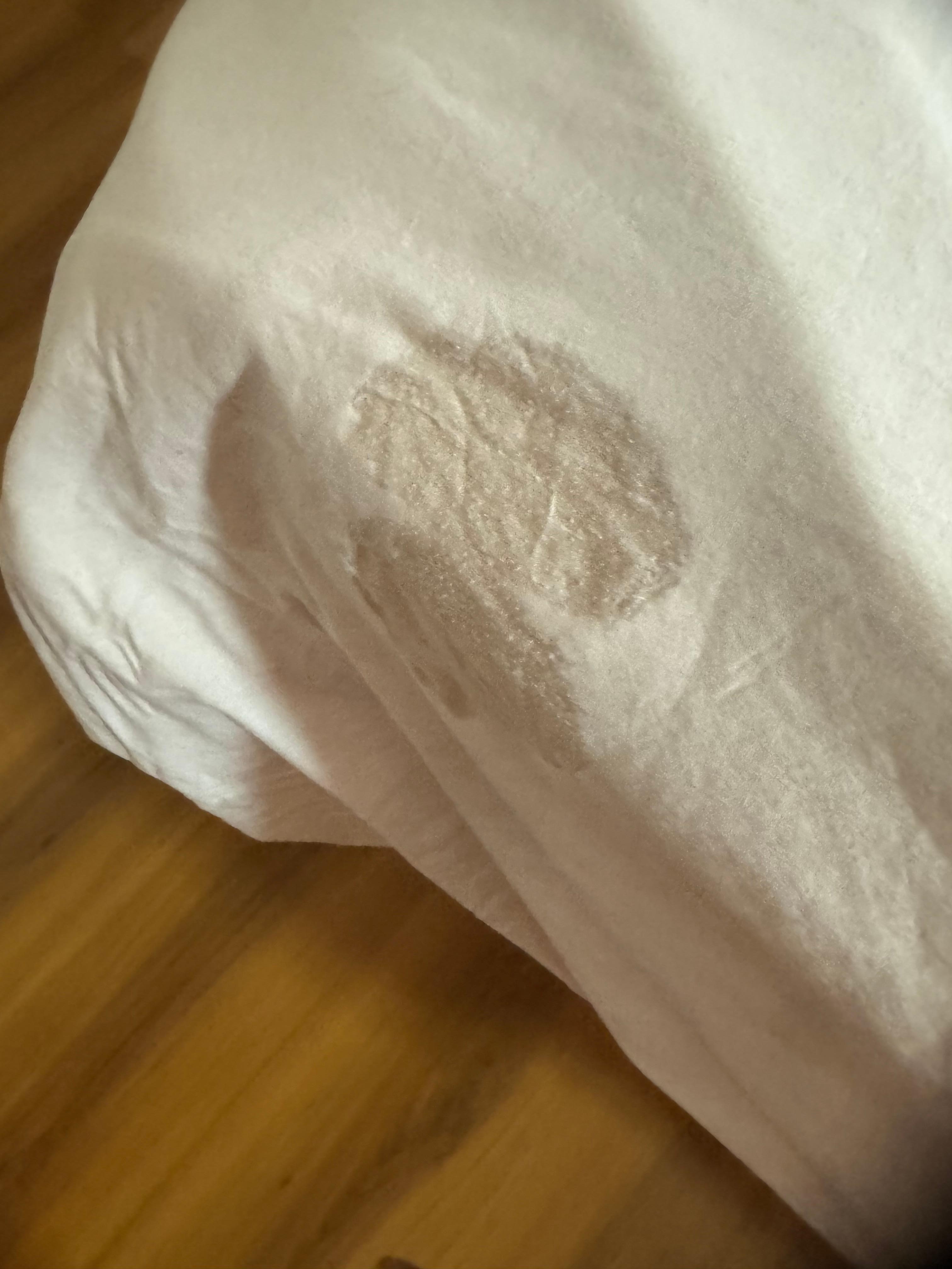 The new sheet they  changed after the first one had stains on it. 