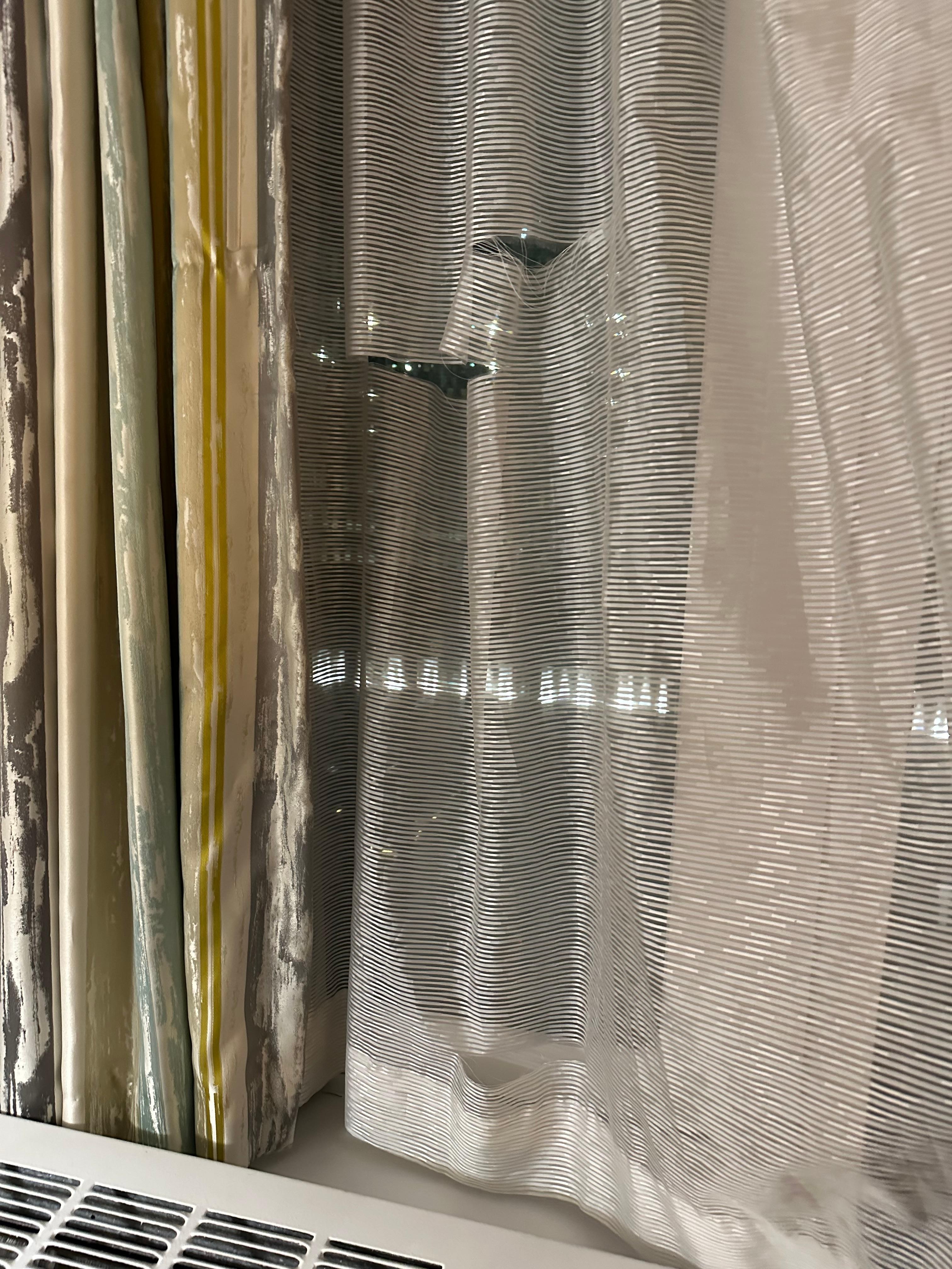 I called the front desk the first day of our stay and requested to send someone to check the drapes/curtain. I remembered a guy name Chris came to our room and check the curtains. Again, he told us that the hotel is in the process of new ownership.