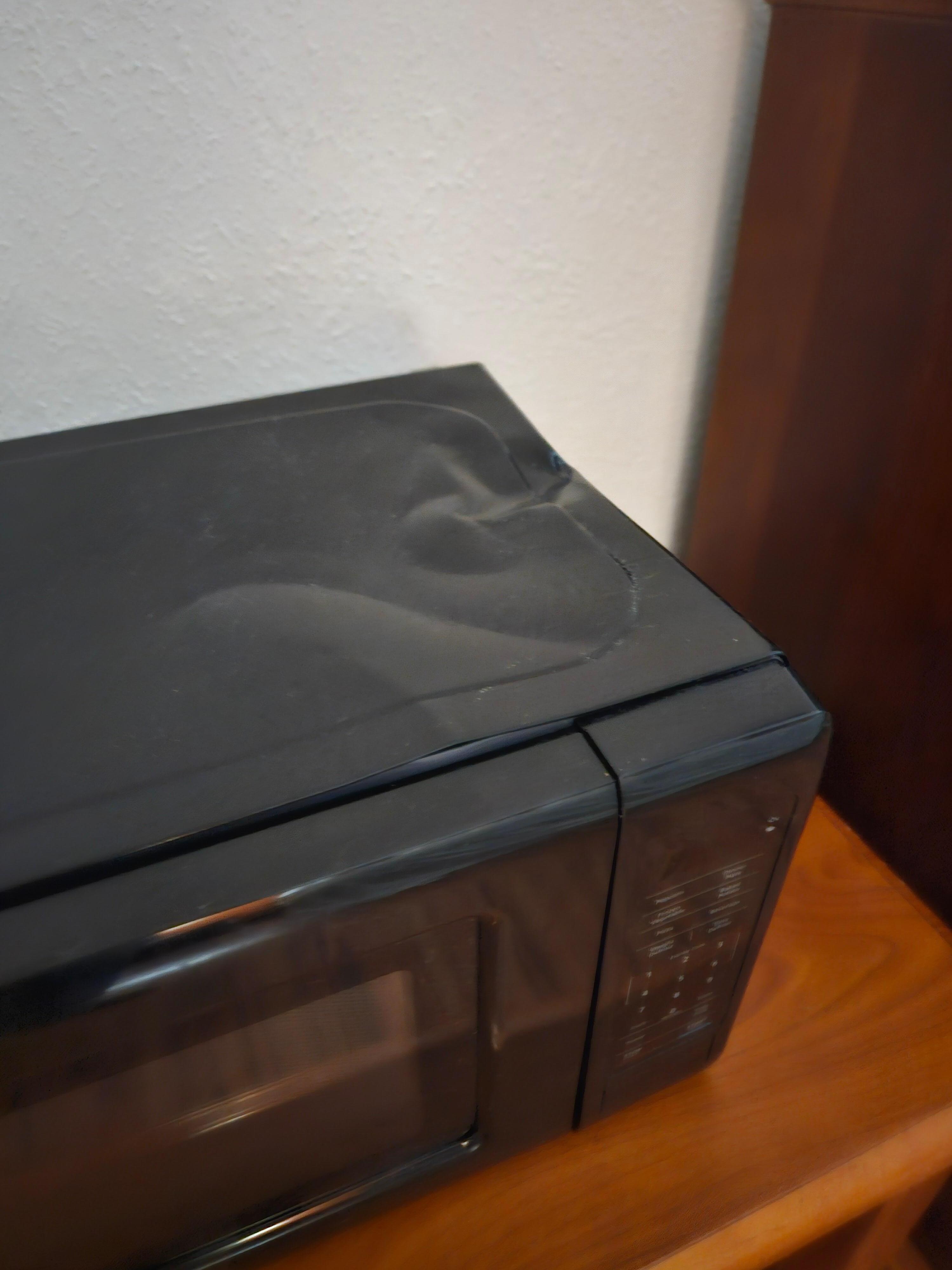 Microwave was smashed, you could see light from the front on the top when used