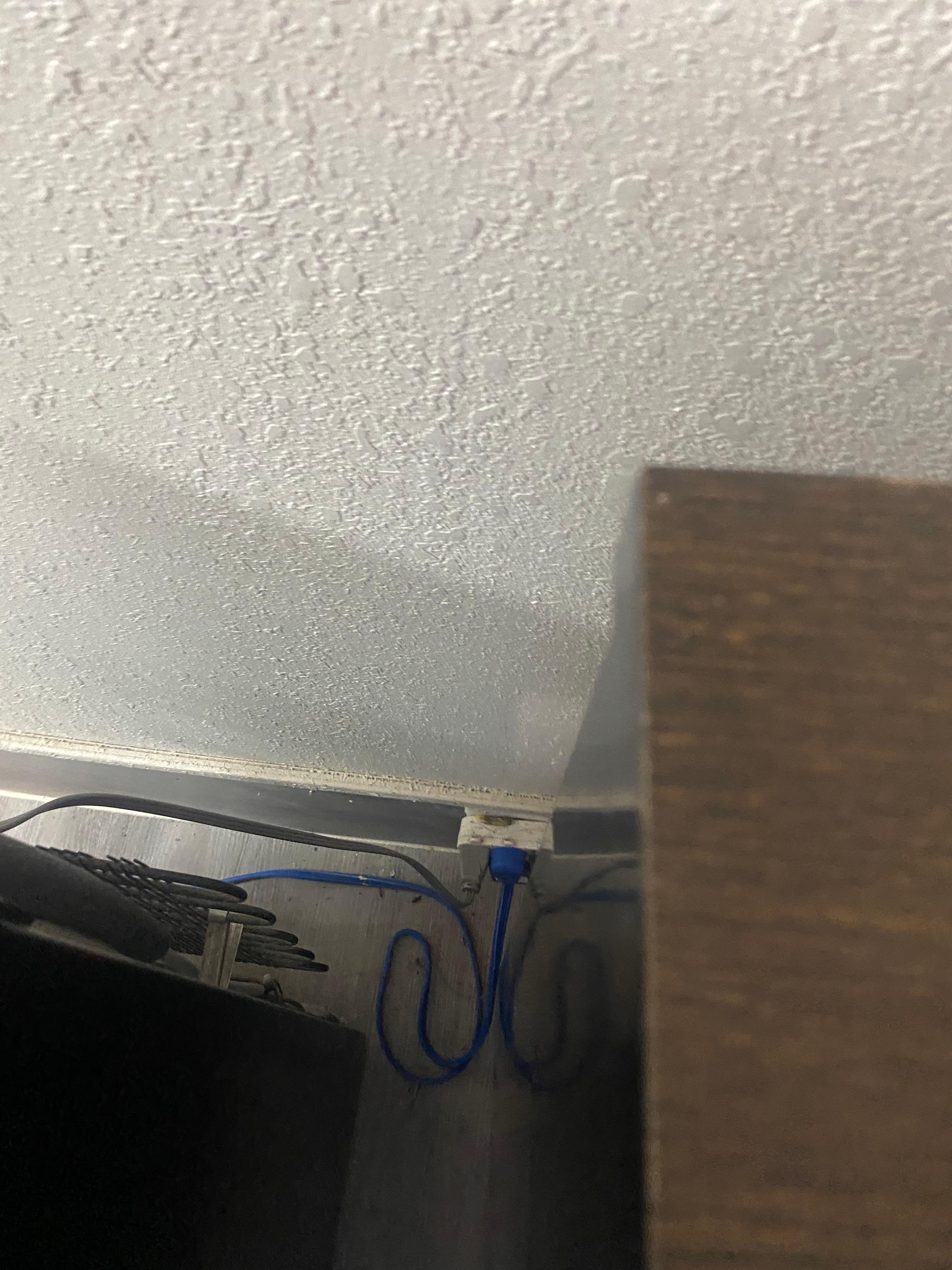 This is beside the refrigerator and microwave. It was a phone but it didn’t have an outlook to plug it in to. 