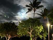 Close shopping center looking out on a full moon.