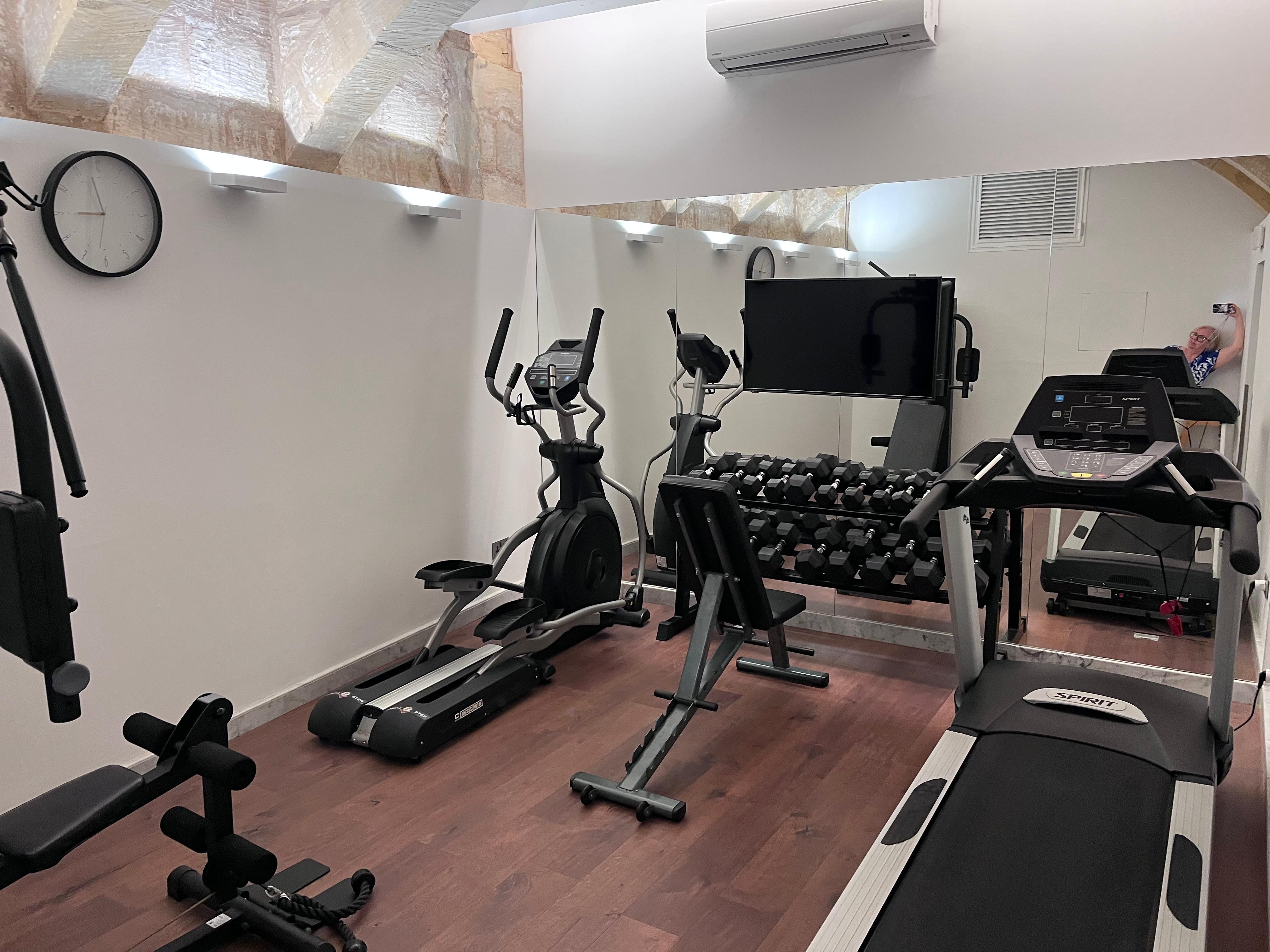 Well equipped gym in basement