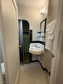 Bathroom is tiny. Toilet is behind door and sits very low. No electrical outlet. Shower is like a cave -no window or light