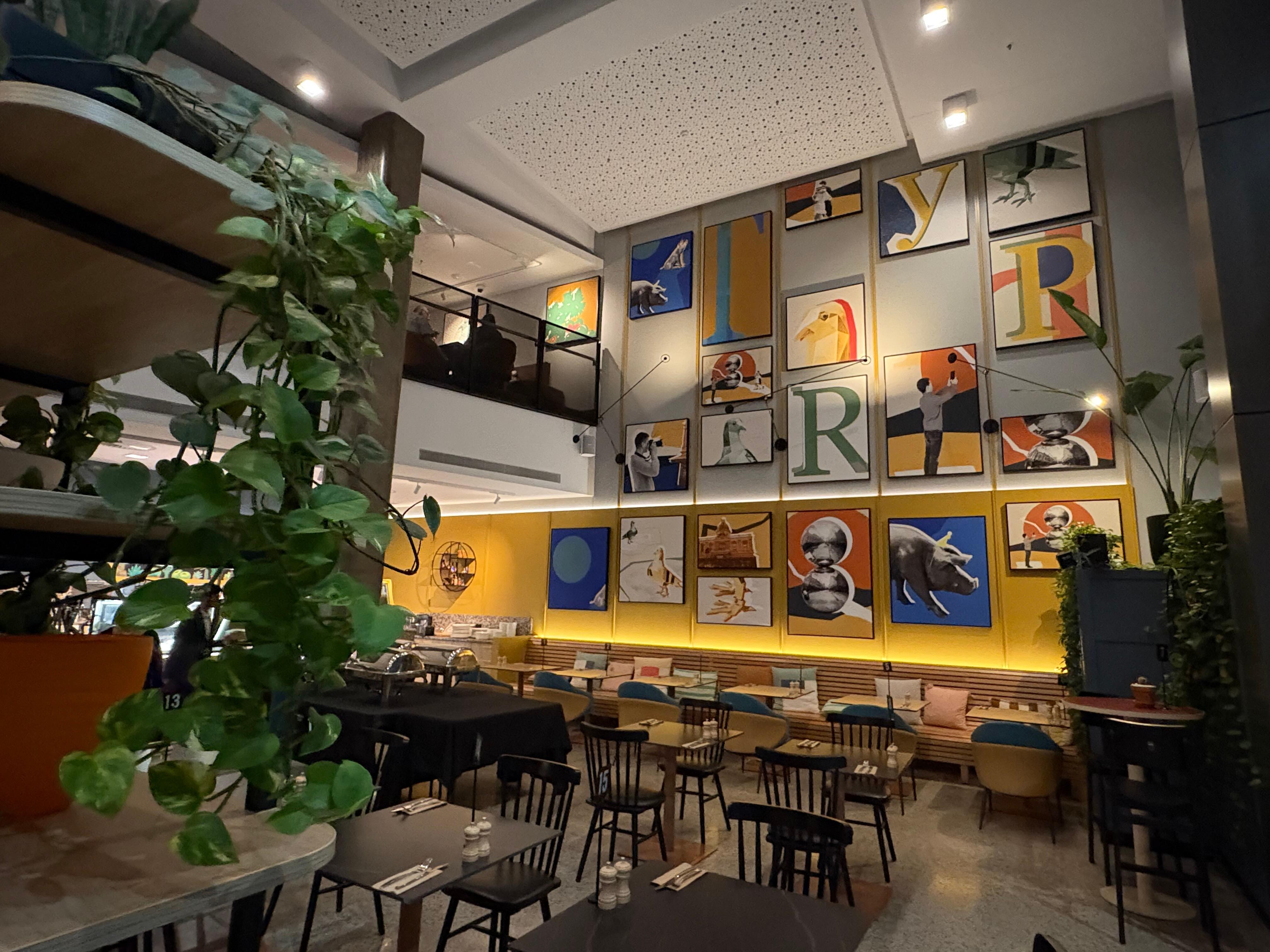 Lobby and cafe with restaurant at the top.