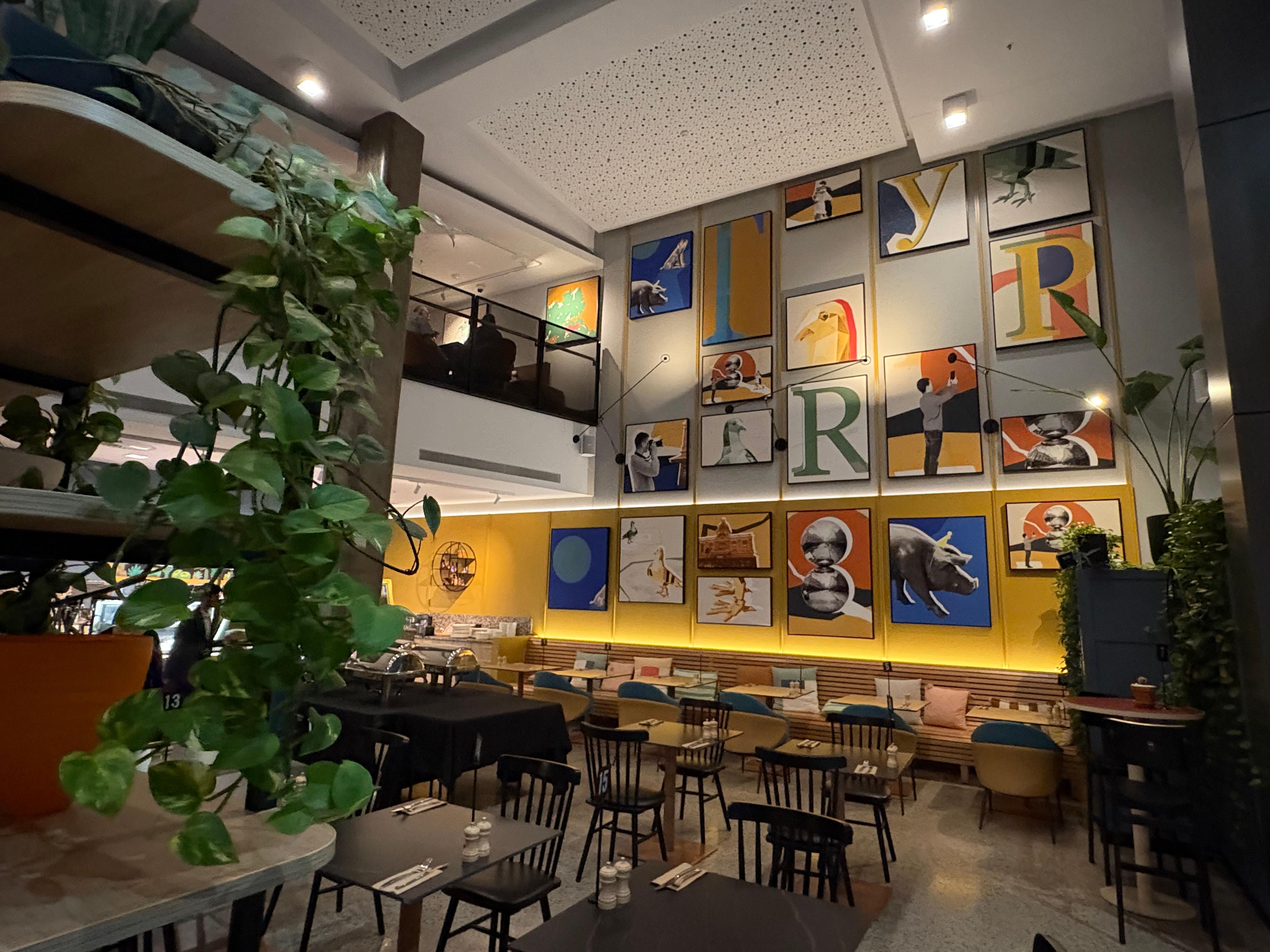Lobby and cafe with restaurant at the top.