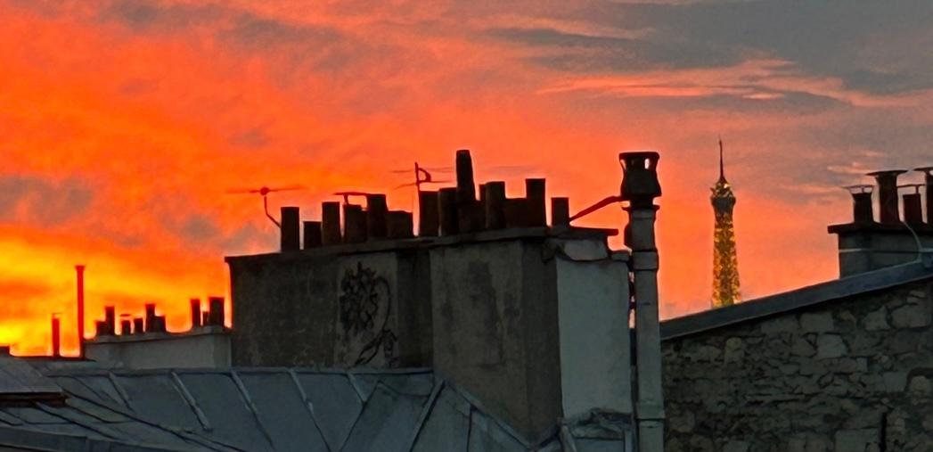 Partial view of Eiffel Tower and the rooftops from our room 