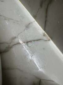 Dirty countertops that had remnants of toothpaste from previous tenants