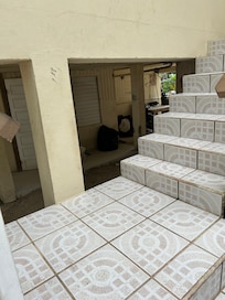 Tried to grab a pic of the trash under the steps discretely, so pic isn’t great. Just know it was much worse in person