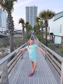 The walkway to the beach. They have a nice shower at the end to wash your get, body and also a hose to rinse off the boards.