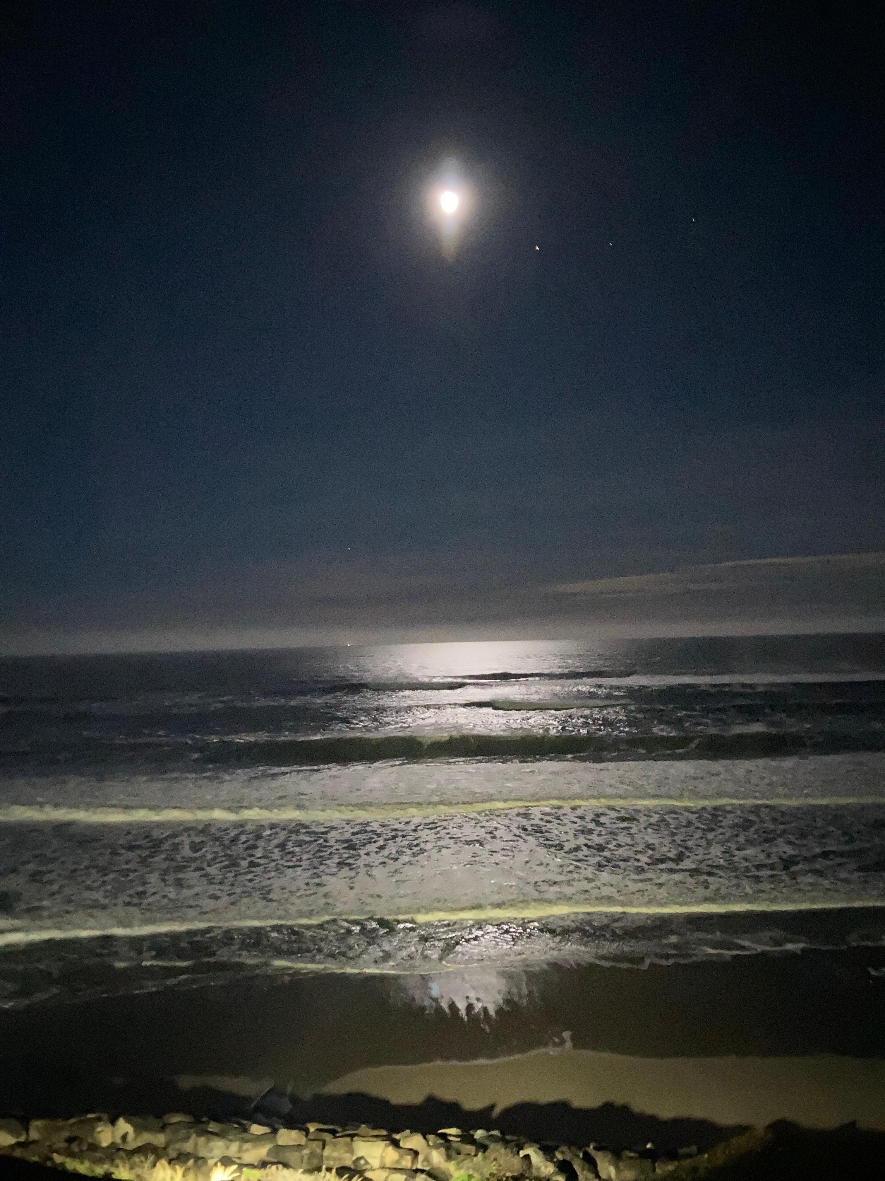 Early morning full moon over the ocean from our balcony.