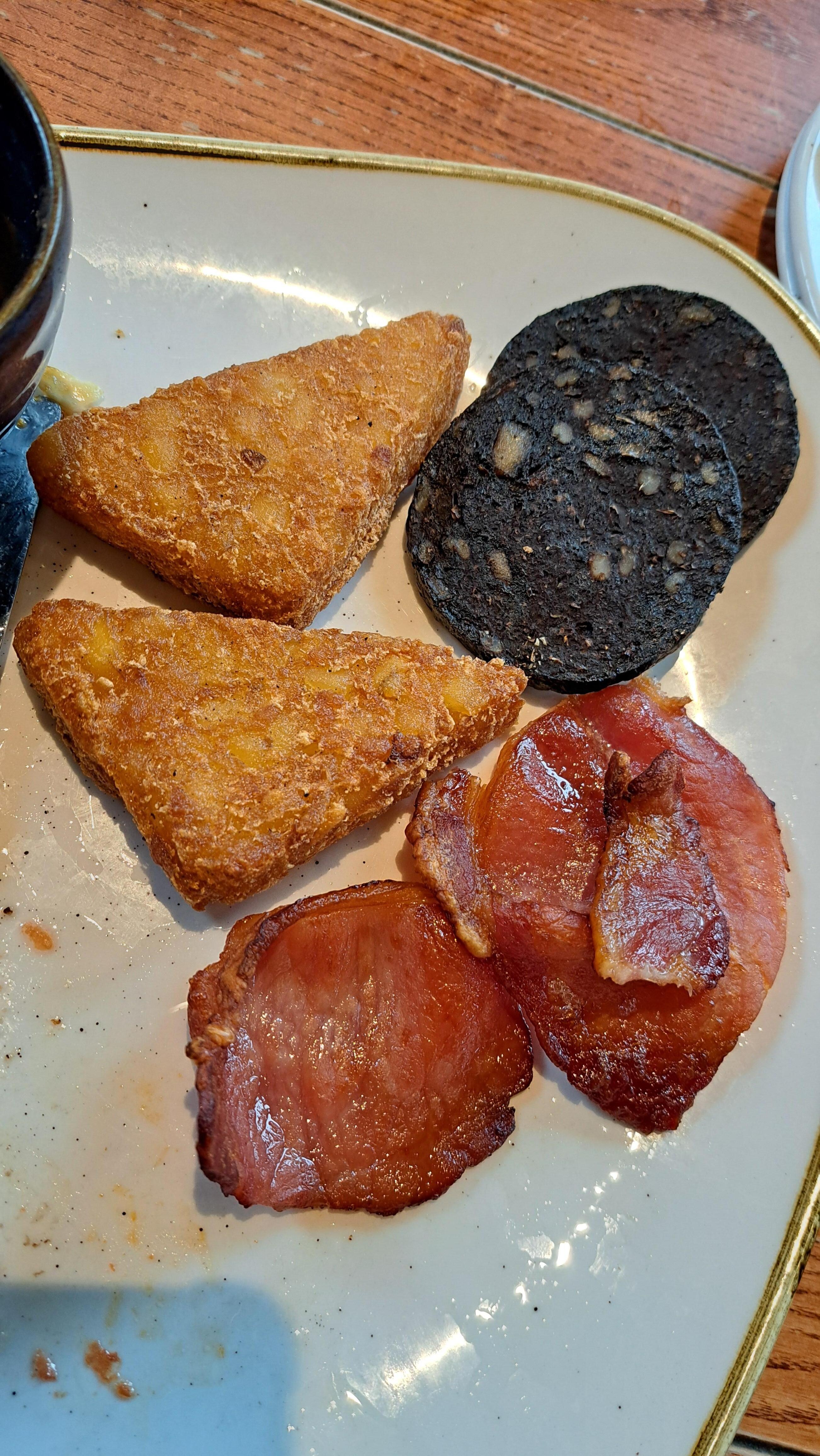 Very over cooked bacon and hashbrown, dry and hard to eat.