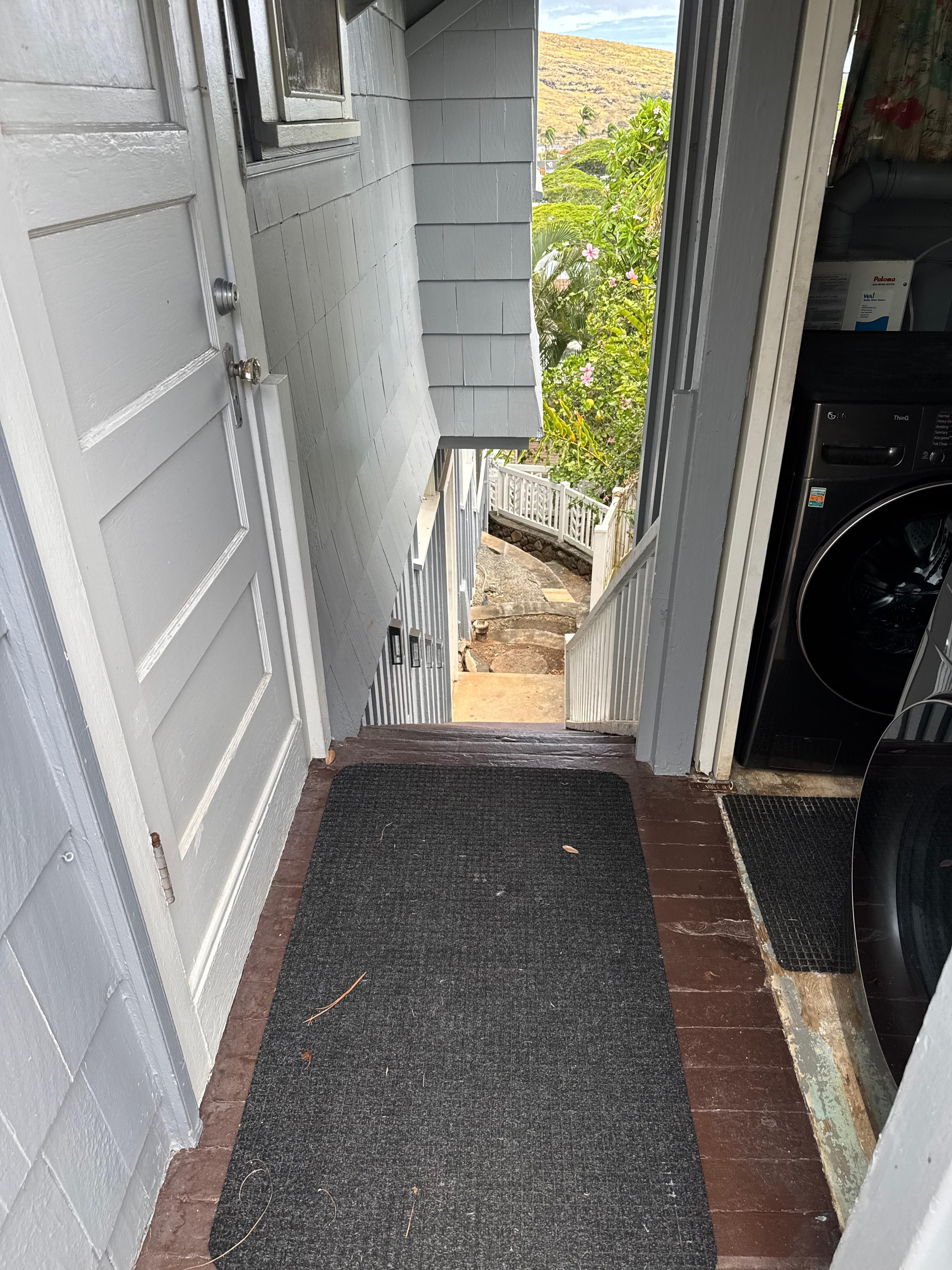 Stairs next to shared laundry 